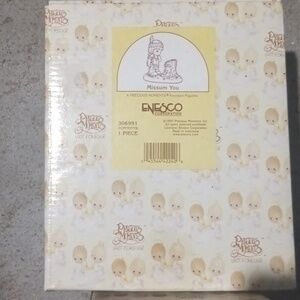 2 precious moment figurines